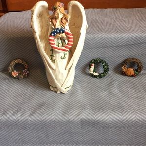 Decorative angel with changing wreaths